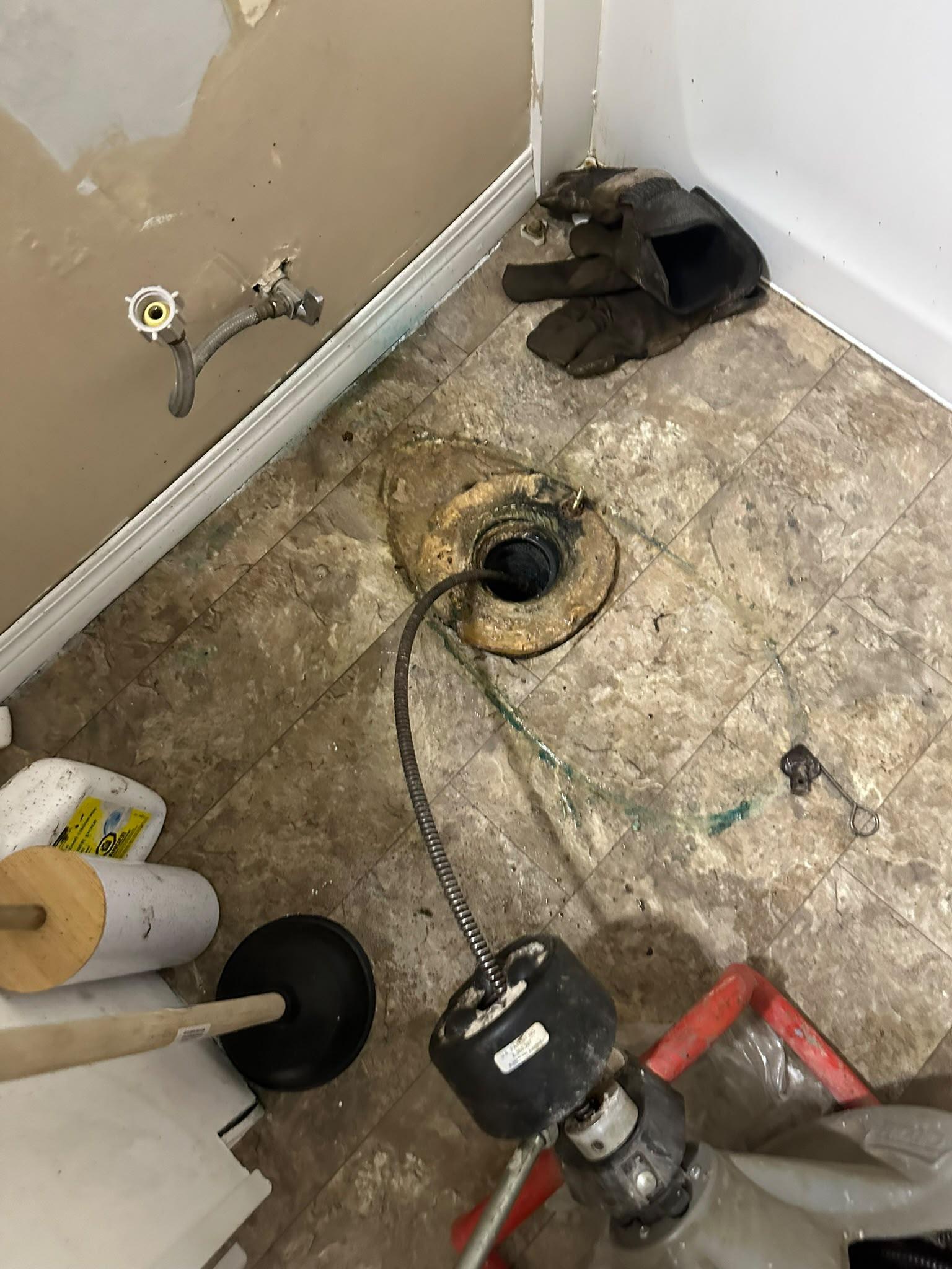 Pro Drain Cleaning technician on a residential drain cleaning job in Winnipeg