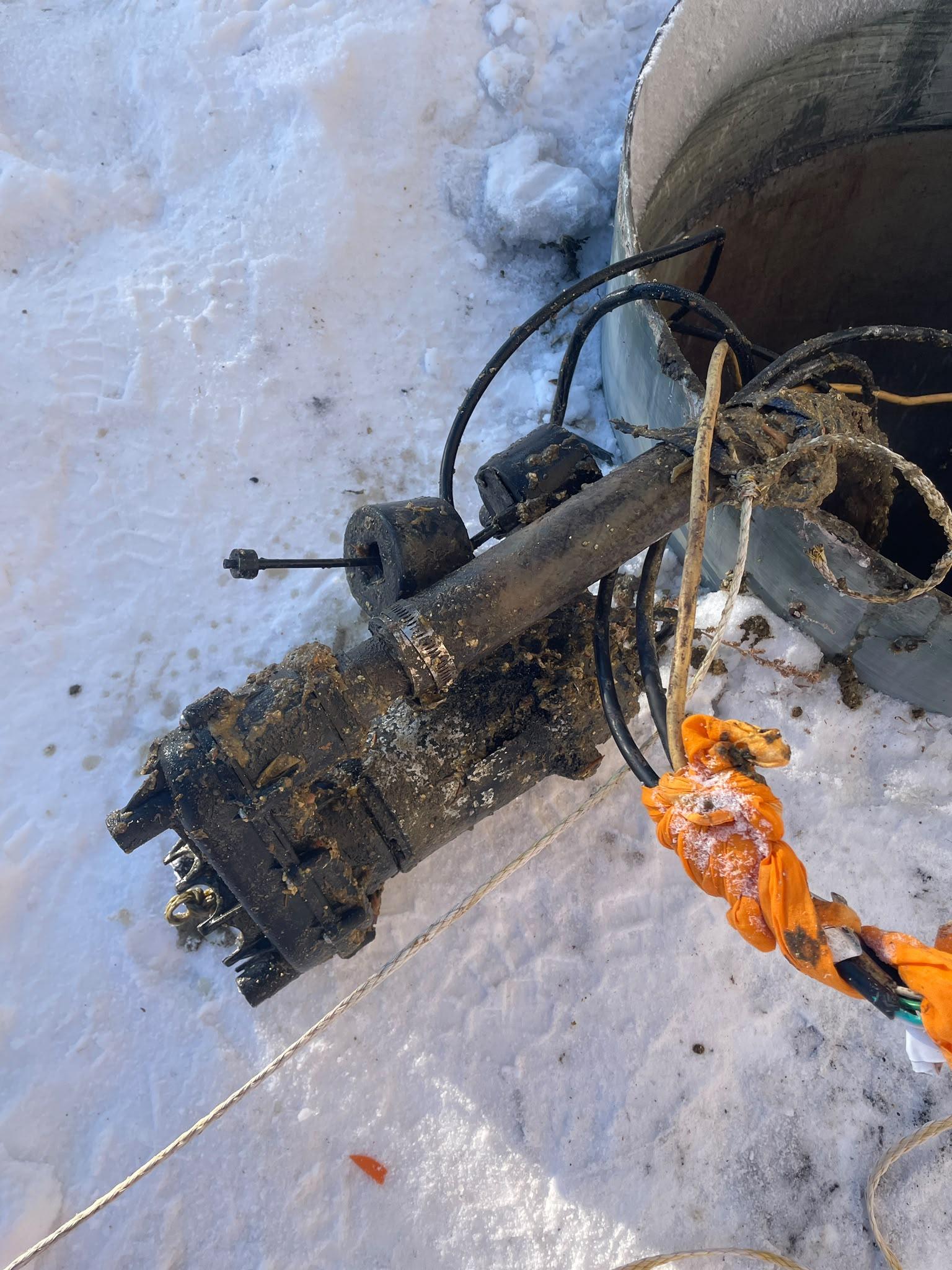 Pro Drain Cleaning crew member completing a drain service call in Winnipeg